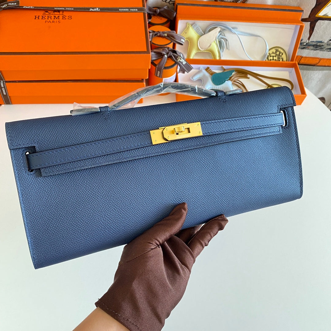 HERMES KELLY CUT 31 IN CLASSIC BLUE CALFSKIN WITH GOLD HARDWARE