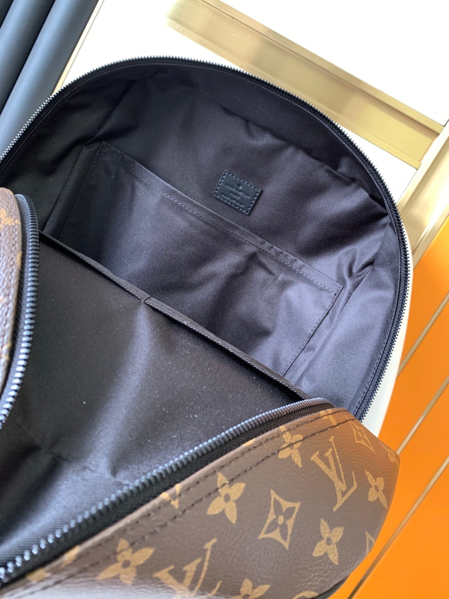 LOUIS VUITTON DEAN BACKPACK 42 IN BLACK AND BROWN MONOGRAM CANVAS