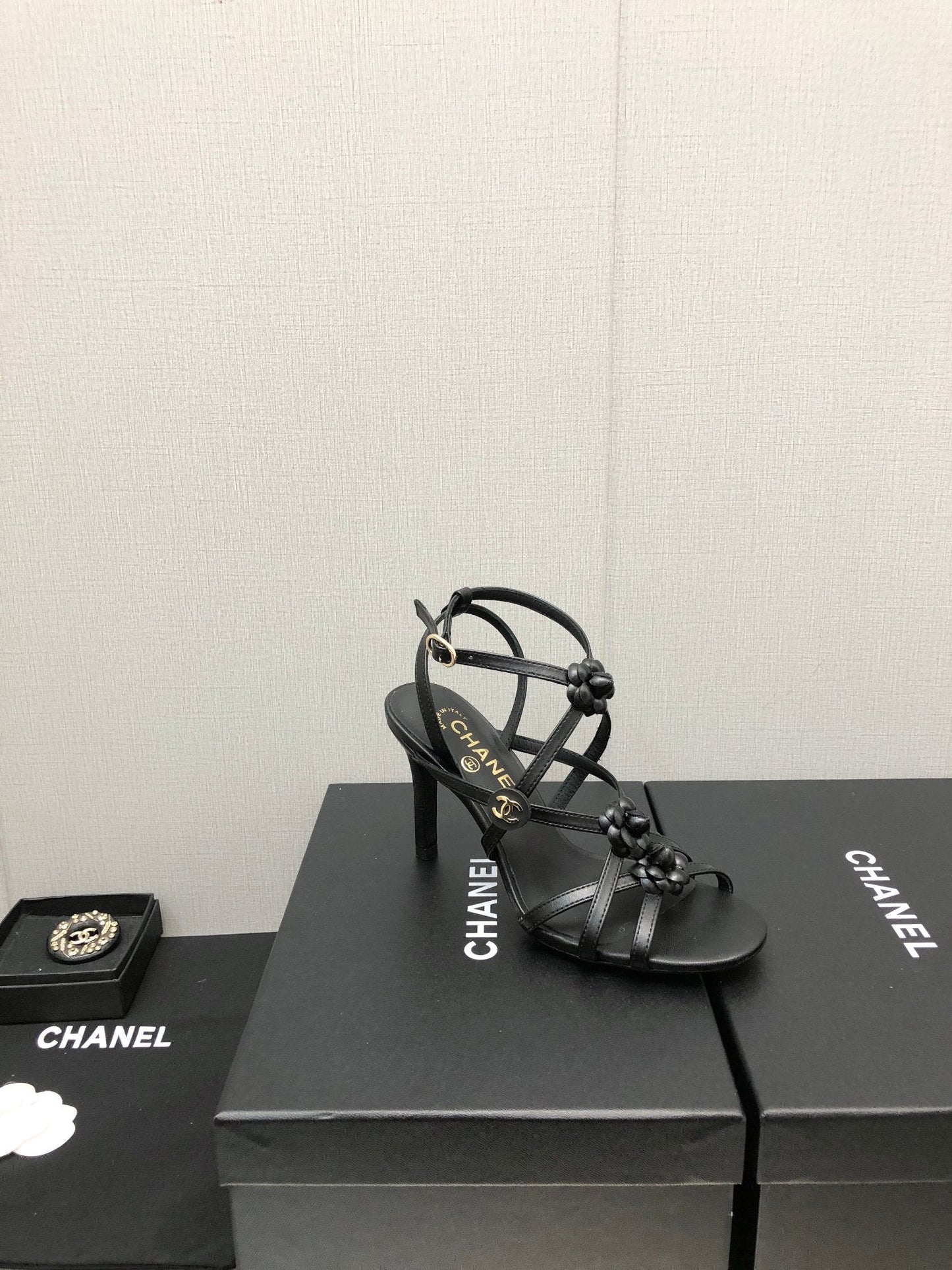 CHANEL FLORAL HIGH HEEL SANDAL IN BLACK LAMBSKIN