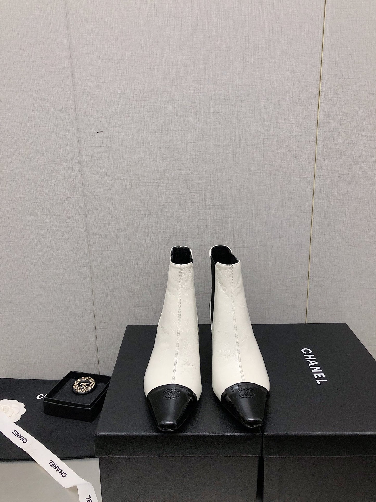 CHANEL SHORT BOOTS IN WHITE MIX BLACK SHEEPSKIN