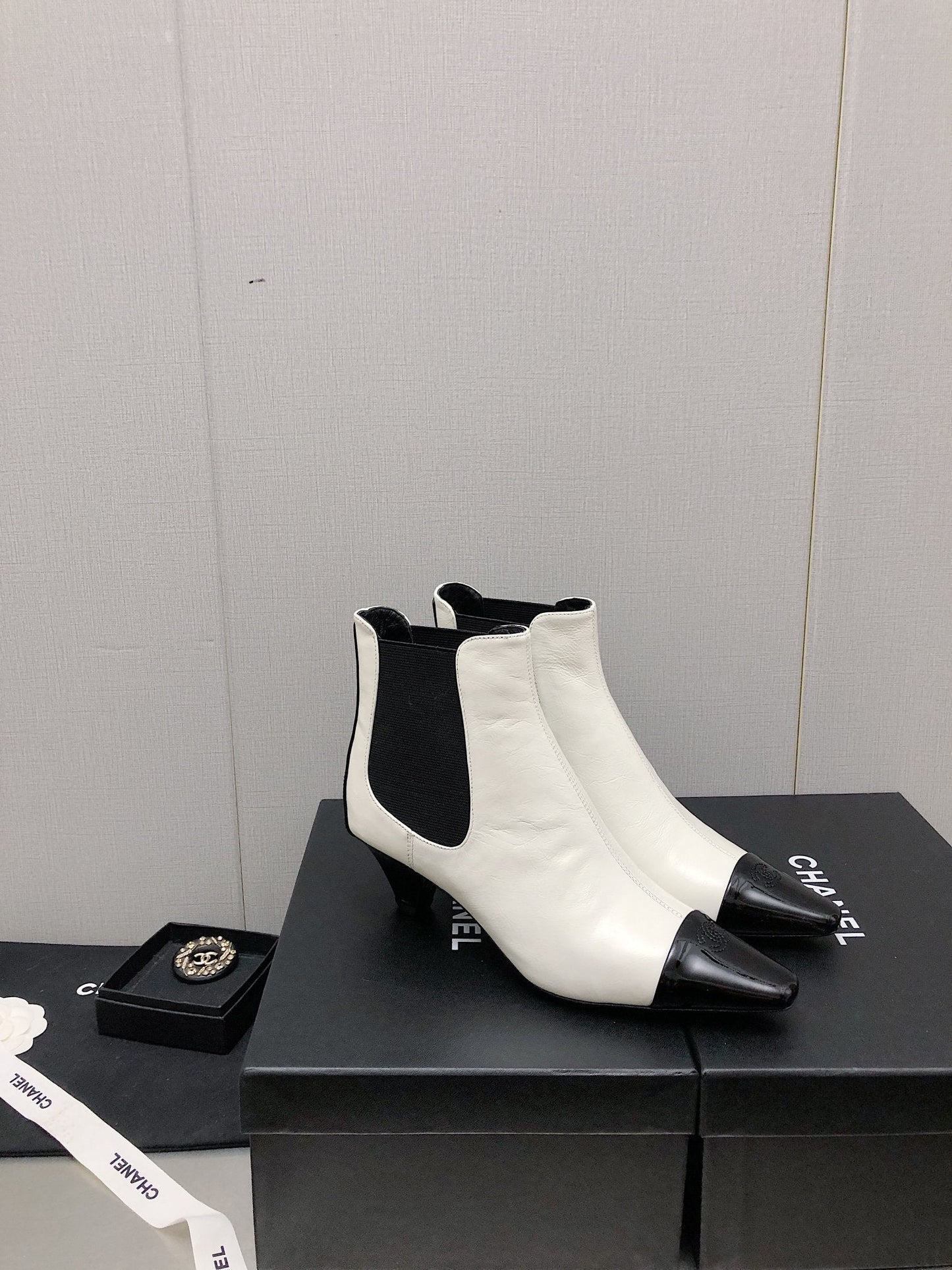 CHANEL SHORT BOOTS IN WHITE MIX BLACK SHEEPSKIN