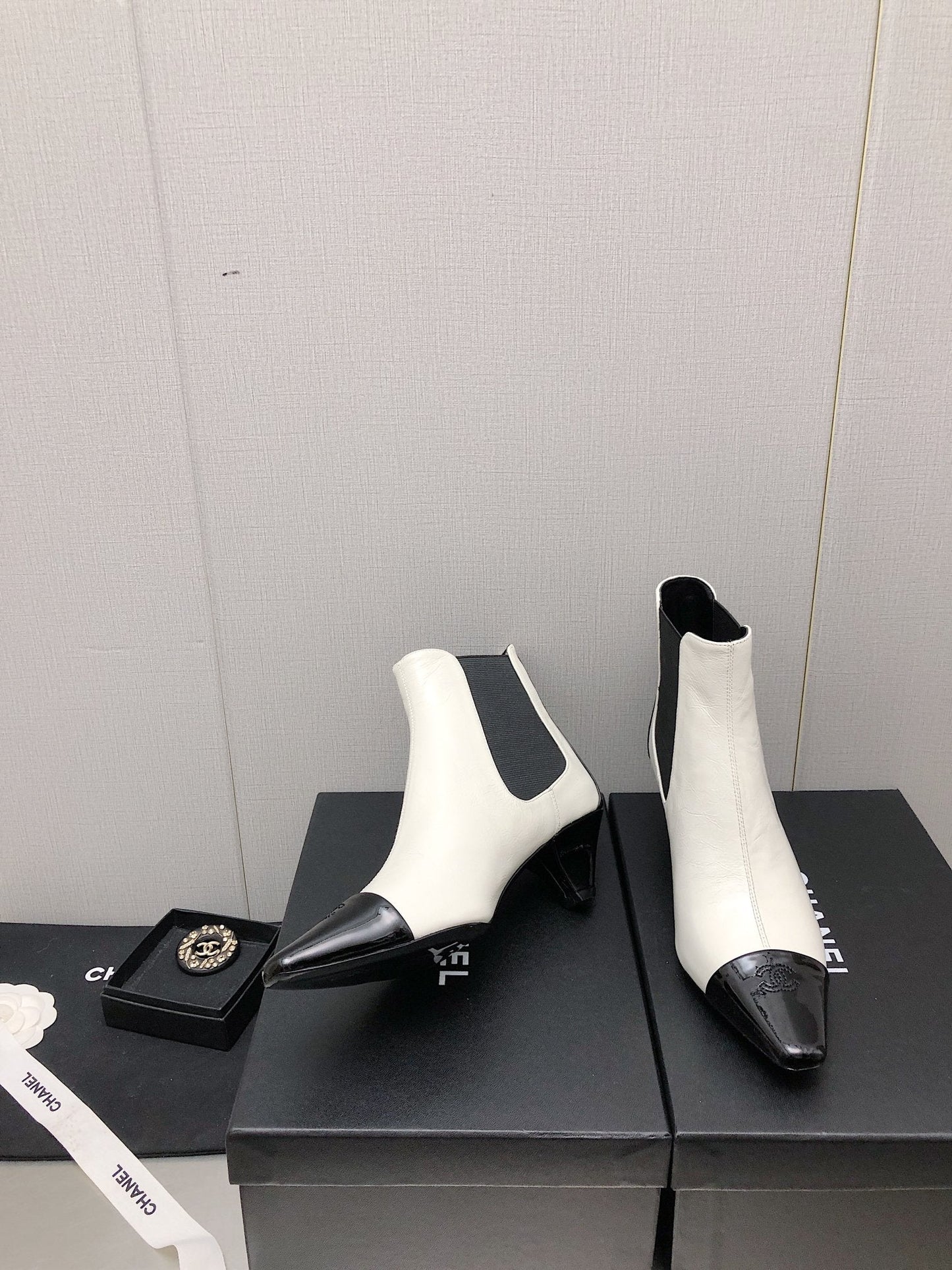 CHANEL SHORT BOOTS IN WHITE MIX BLACK SHEEPSKIN