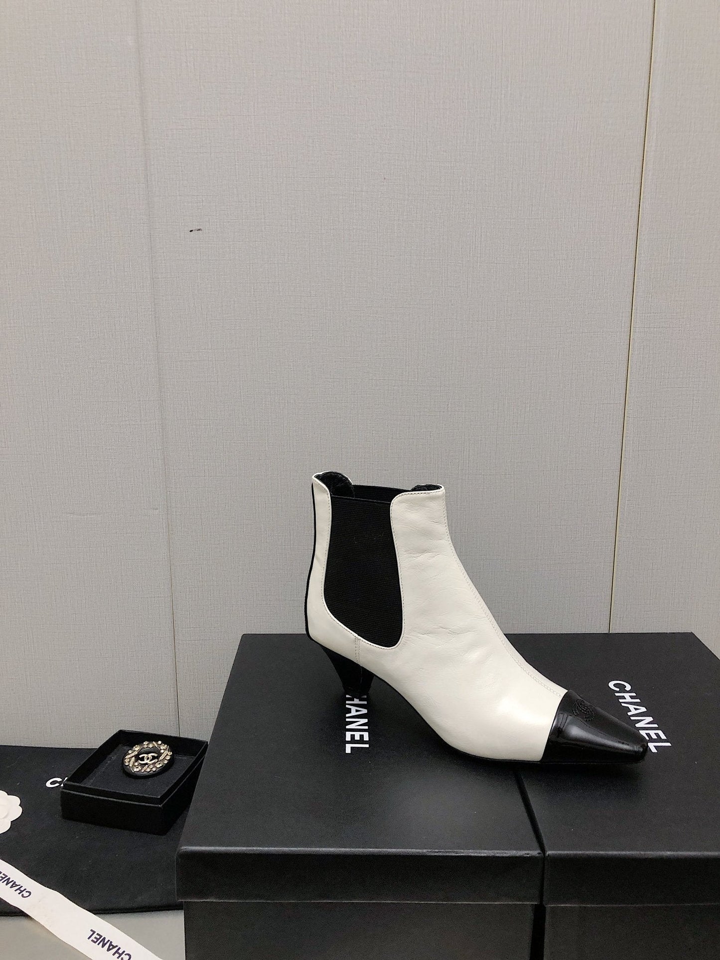 CHANEL SHORT BOOTS IN WHITE MIX BLACK SHEEPSKIN
