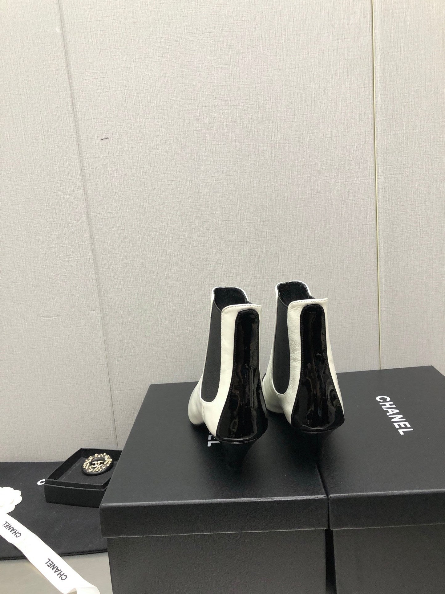 CHANEL SHORT BOOTS IN WHITE MIX BLACK SHEEPSKIN