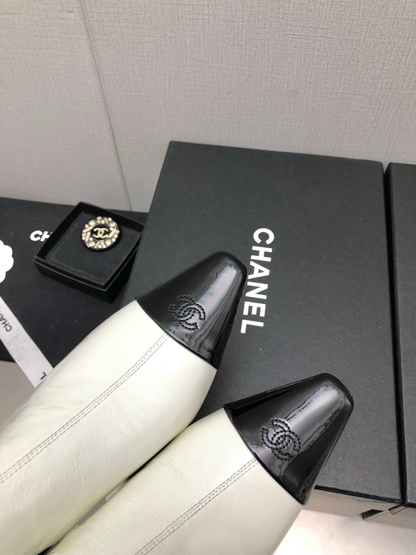 CHANEL SHORT BOOTS IN WHITE MIX BLACK SHEEPSKIN