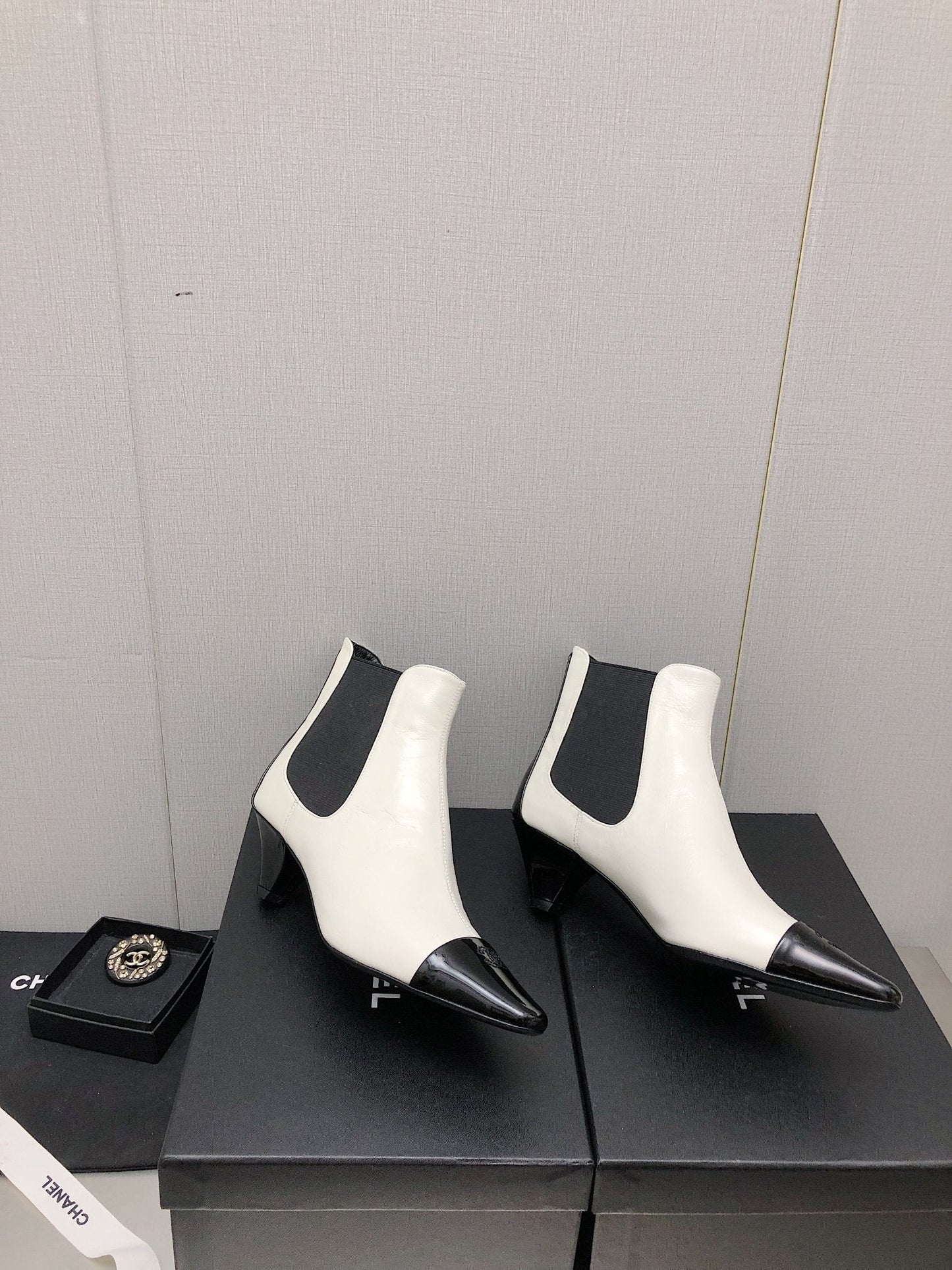 CHANEL SHORT BOOTS IN WHITE MIX BLACK SHEEPSKIN
