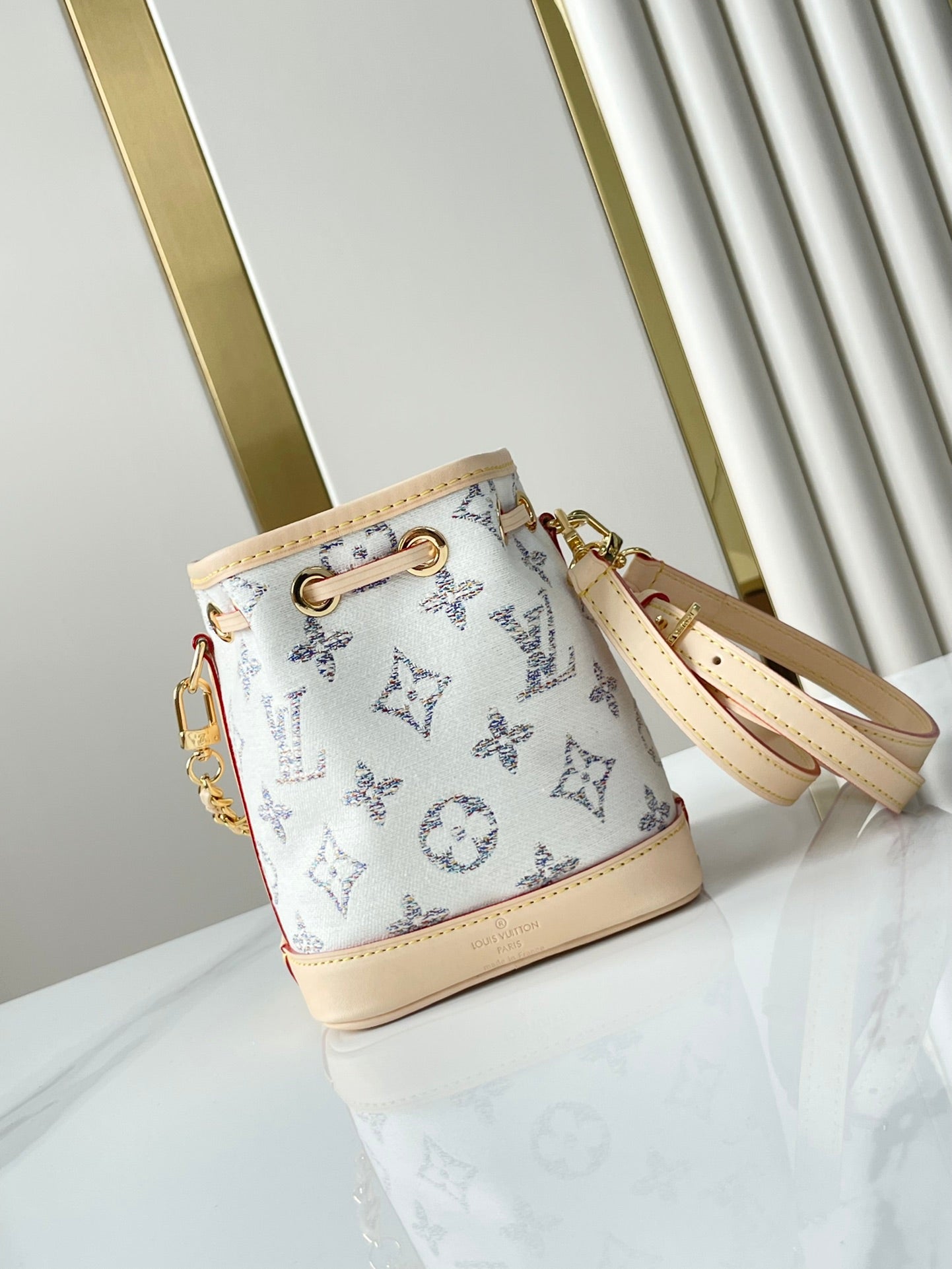 LOUIS VUITTON NANO NOÉ 16 IN WHITE MONOGRAM JACQUARD FABRIC AND BEIGE CALFSKIN TRIM