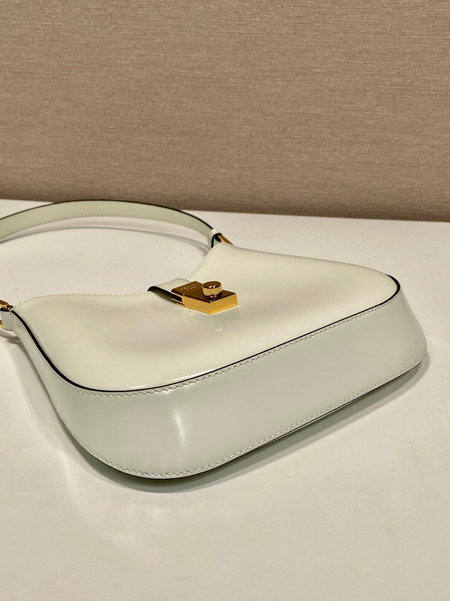 PRADA CLEO SHOULDER BAG 22 IN WHITE BRUSHED LAMBSKIN WITH CLASP CLOSURE