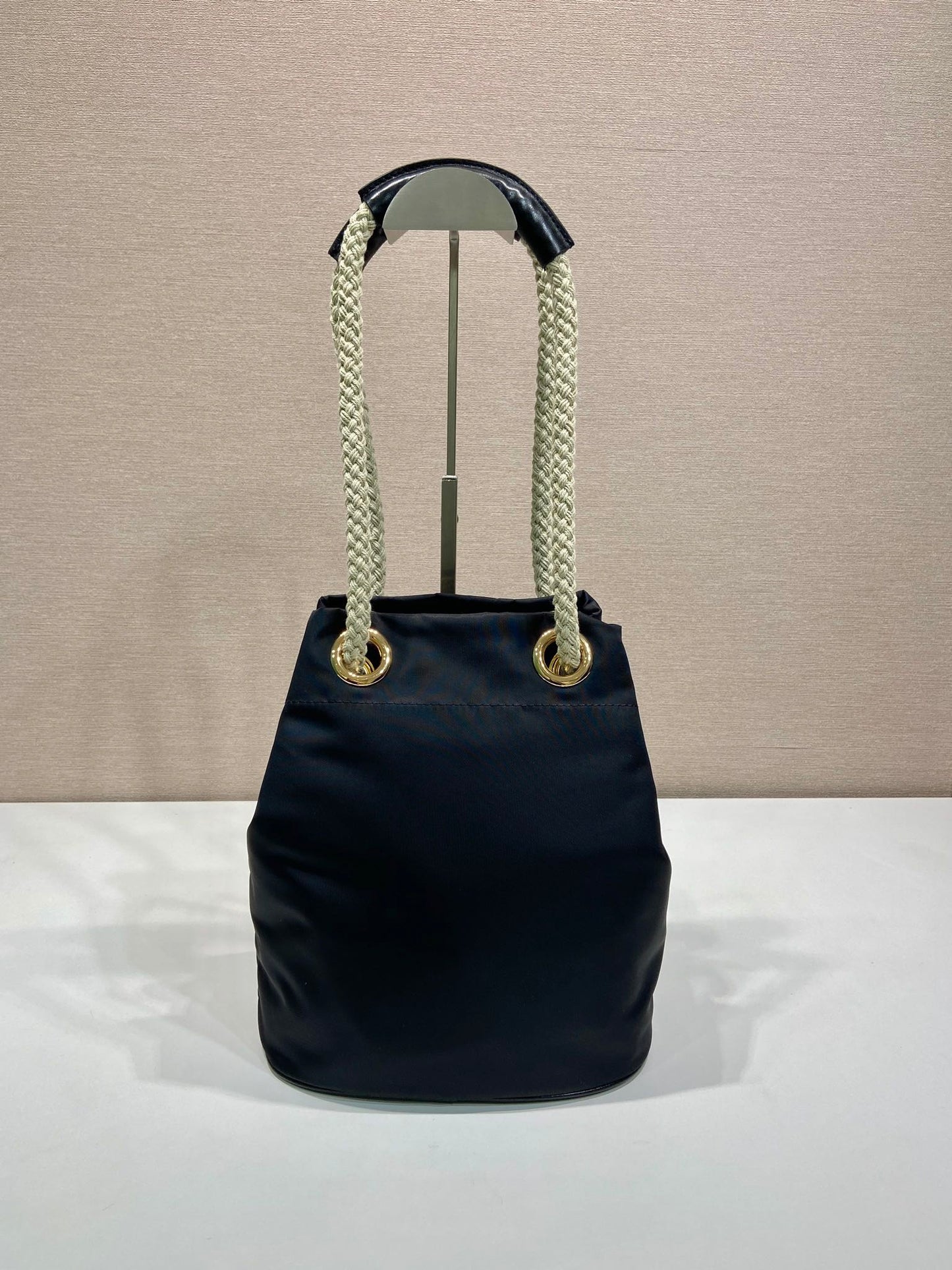 PRADA BUCKET BAG 28 IN BLACK RE-NYLON GOLD LOGO