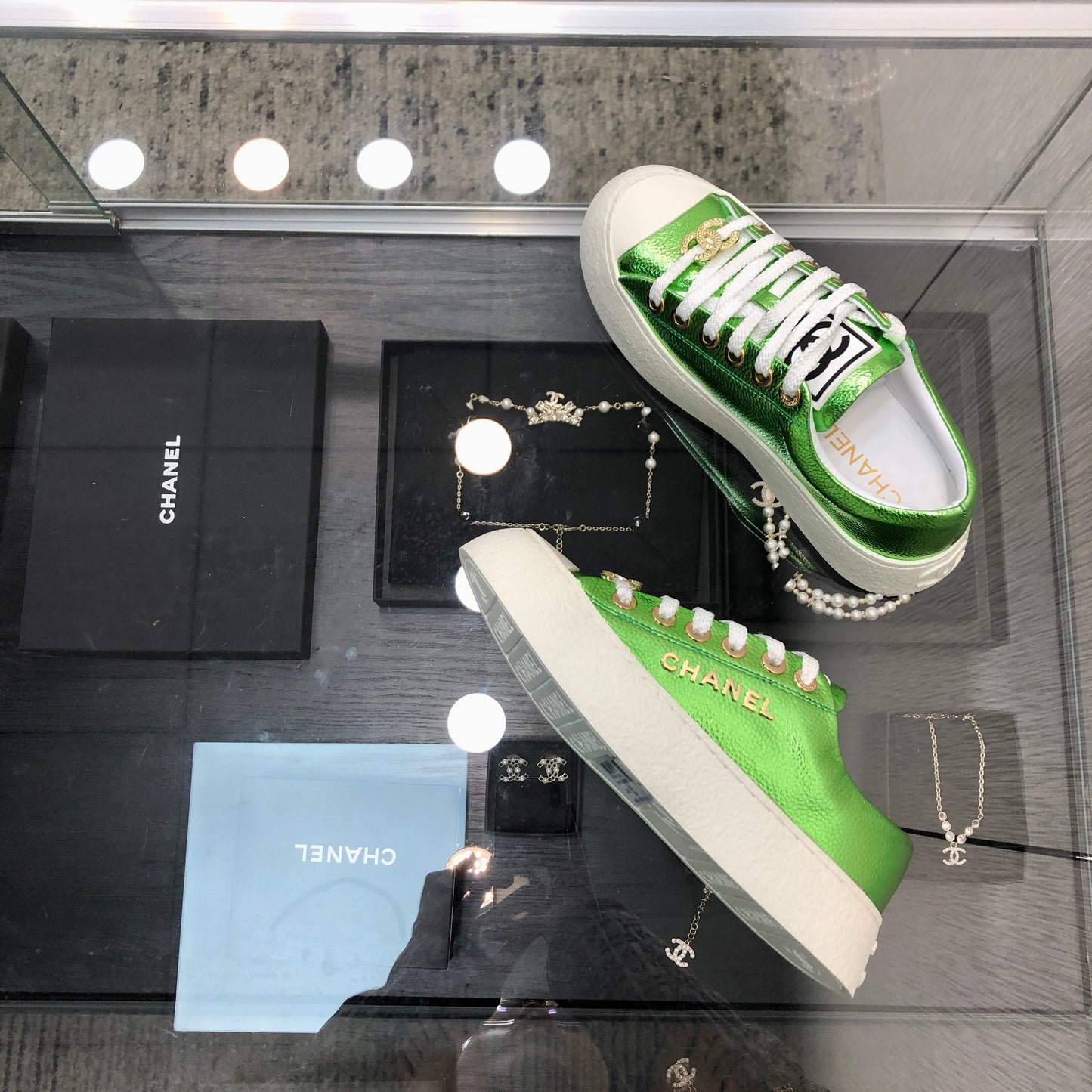 CHANEL CASUAL SNEAKER IN EMERALD GREEN METALLIC LAMBSKIN WITH GOLD LOGO