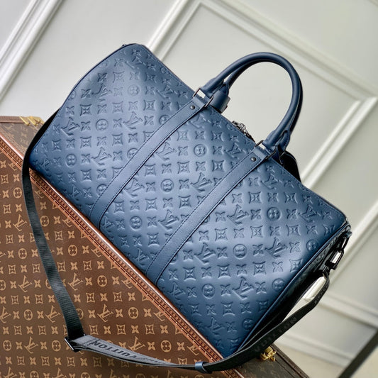 LOUIS VUITTON KEEPALL BANDOULIÈRE 50 IN DARK BLUE MONOGRAM SHADOW EMBOSSED CALFSKIN