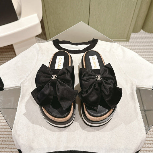 CHANEL SLIPPERS WITH SILK BOW IN BLACK COWHIDE