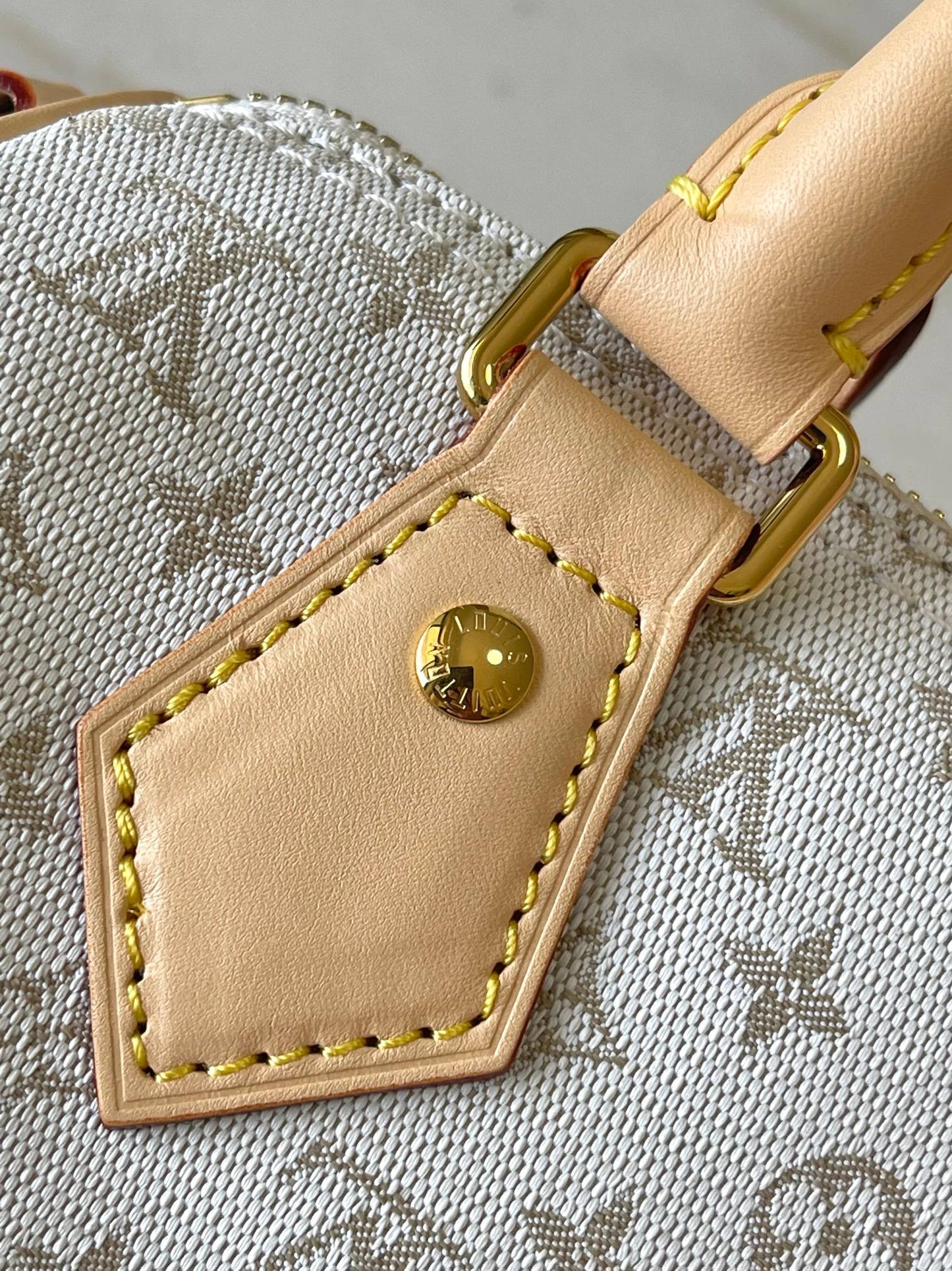 LOUIS VUITTON SPEEDY BANDOULIÈRE 20 IN WHITE MONOGRAM JACQUARD AND BEIGE CALFSKIN TRIM