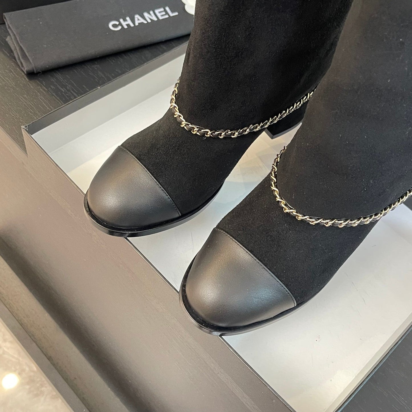 CHANEL SHORT BOOTS 6.5 CM IN BLACK SUEDE AND CALFSKIN