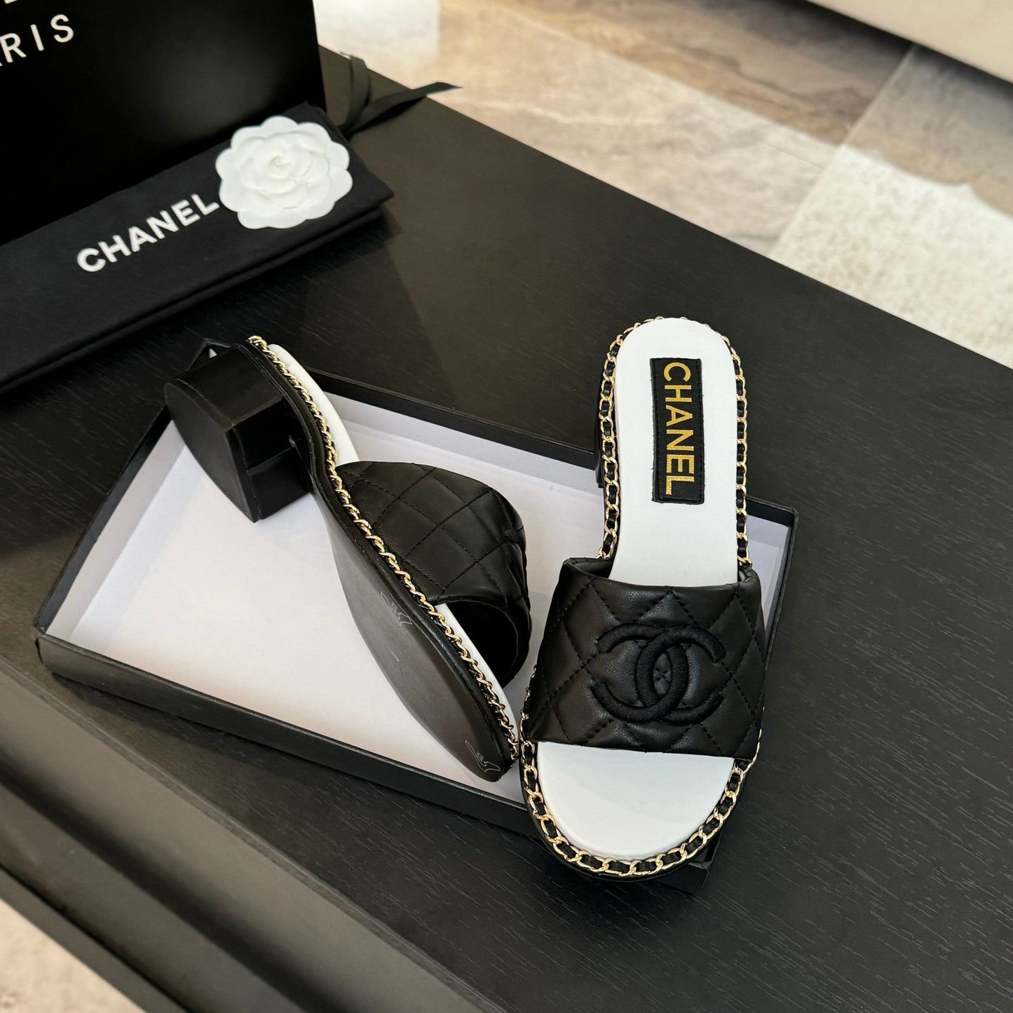 CHANEL HIGH FLATFORM SLIPPER IN BLACK EMBOSSED SHEEPSKIN