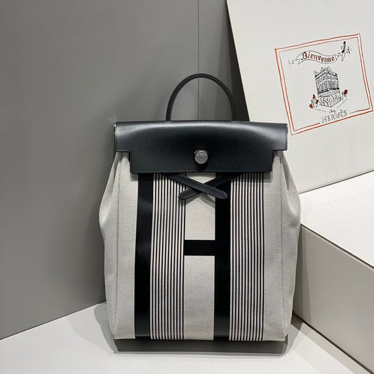HERMES HERBAG A DOS ZIP RETOURNE BACKPACK 29 IN OFF-WHITE MIX BLACK CANVAS AND CALFSKIN