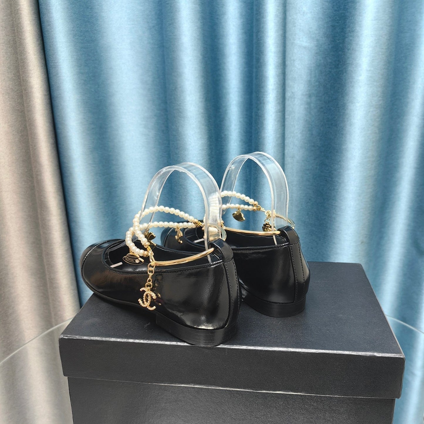 CHANEL MARY JANE WITH PEARL STRAP IN GLOSSY BLACK LAMBSKIN