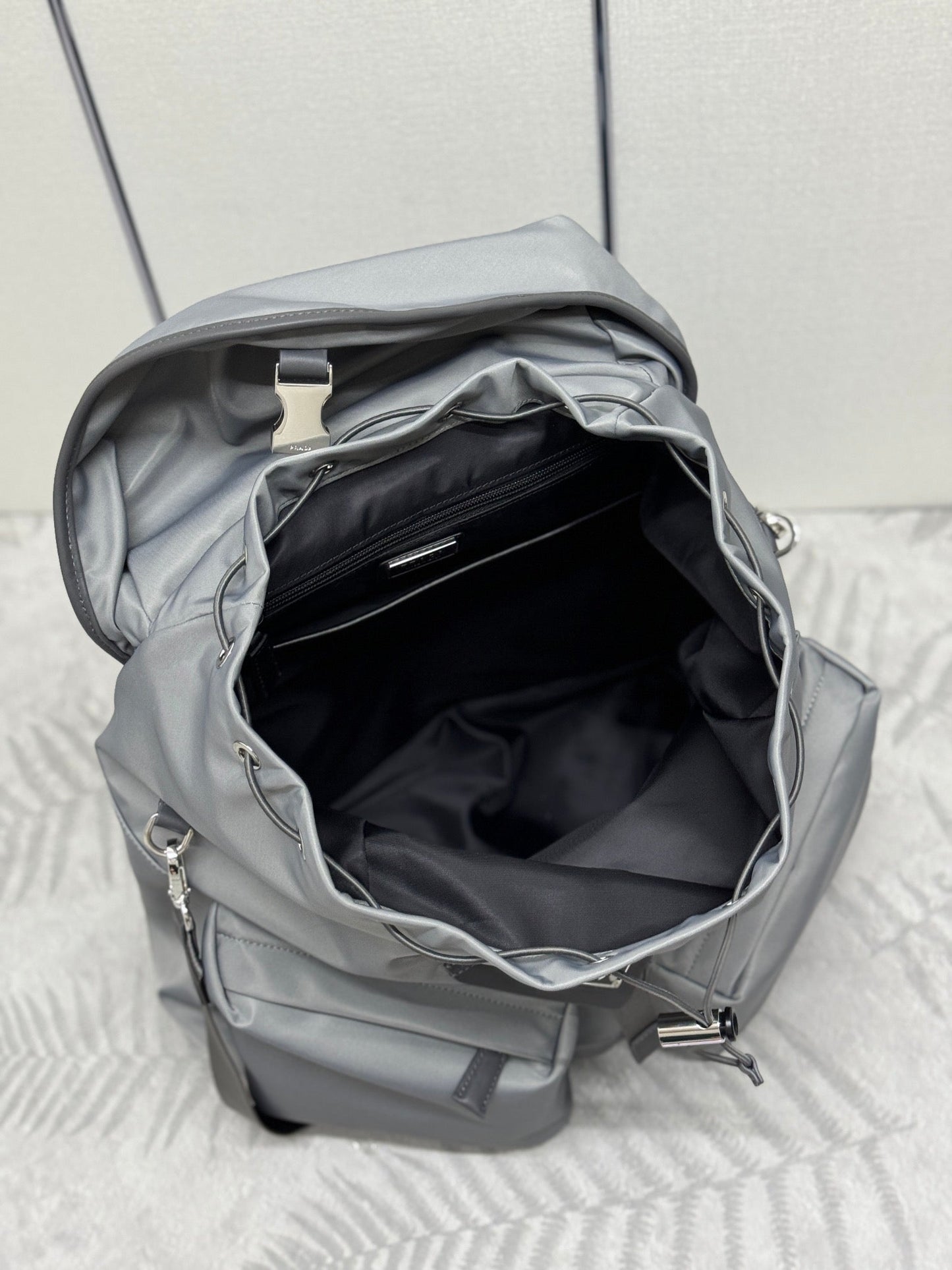 PRADA TRIANGLE LOGO BACKPACK 42 IN RHINO GRAY RE-NYLON
