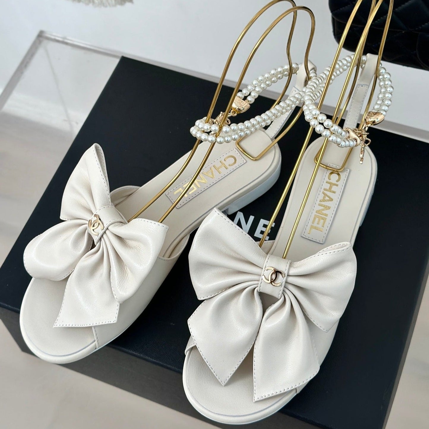 CHANEL Double C Big Bow Pearl Chain Sandals White Lambskin