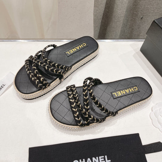 CHANEL WOVEN STRAP SLIPPERS IN BLACK LAMBSKIN